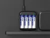 A battery charger with four AA batteries inserted, plugged into a power source. Produktbild-Vorschau