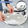 Hands installing mop pads onto a robot vacuum cleaner. Produktbild-Vorschau