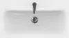 A top-down view of a white sink with a silver faucet and drain. Produktbild-Vorschau