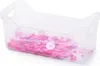 A clear plastic storage bin filled with pink buttons. Anteprima dell’immagine prodotto