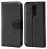 A black flip case for a smartphone is shown from two angles, front and back. Náhľad obrázku produktu