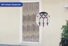 A beaded curtain hanging in a doorway, with a close-up inset showing the detail of the beads. Produktbild-Vorschau