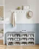 A hallway shoe storage bench and coat rack with a hat, scarf, and shoes. Produktbild-Vorschau