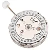 A close-up view of a watch movement with a date complication. Náhled obrázku produktu