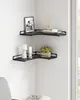 A corner of a room with two black corner shelves mounted on the wall. Produktbild-Vorschau