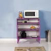 A purple cabinet with a microwave and decorative items on a light blue wall background. Voir les images du produit