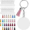A collection of acrylic keychain blanks and colorful tassels, along with a sample assembled keychain with a pink tassel and a blank round acrylic disc. Produktbild-Vorschau