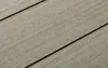 A close-up view of a weathered wooden surface, showing the grain and texture of the material. Anteprima dell’immagine prodotto