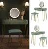 A vanity table set with a mirror and stool, shown in different angles and settings. Produktbild-Vorschau