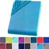 A folded turquoise fitted sheet is displayed against a white background, with a row of color swatches shown below. Produktbild-Vorschau