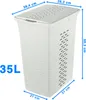A white laundry basket with dimensions indicated by blue lines and text. Voir les images du produit