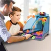 A father and son are playing an electronic arcade basketball game. Produktbild-Vorschau