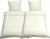 Two cream-colored duvet covers and pillowcases are displayed side-by-side against a white background. Produktbild-Vorschau