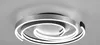 A modern LED ceiling light with a swirling design, mounted on a ceiling. Anteprima dell’immagine prodotto