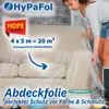 A woman is covering a sofa with a transparent plastic sheet. Produktbild-Vorschau