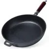 A black cast iron frying pan with a wooden handle is shown against a white background. Produktbild-Vorschau