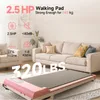 A pink walking pad is shown in a living room setting with a couch in the background. Produktbild-Vorschau