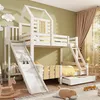 A child's bedroom with a white wooden bunk bed featuring a house-shaped top bunk, a slide, and a pull-out drawer. The room has green walls and beige curtains. Náhled obrázku produktu
