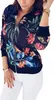 A woman is wearing a bomber jacket with a floral print. Anteprima dell’immagine prodotto