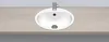A white oval sink is embedded in a light brown countertop. Produktbild-Vorschau