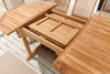 A wooden garden table with an extension leaf being pulled out. Produktbild-Vorschau