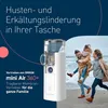 A family is walking on a beach while a nebulizer is shown in the foreground with marketing text. Náhled obrázku produktu