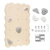 A wooden climbing wall with attached climbing holds, along with various hardware and additional climbing holds, laid out on a white background. Voir les images du produit