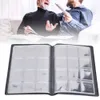 Two men are looking at a coin album. Podgląd zdjęcia produktu