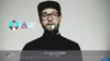 A man wearing glasses and a black cap is shown singing, with on-screen graphics indicating a game interface. Náhľad obrázku produktu