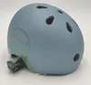A blue and green helmet on a white background. Voir les images du produit