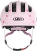 The back view of a pink child's bicycle helmet with butterfly and star decorations. Náhled obrázku produktu