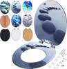 A collage of different toilet seats with various designs, and a large toilet seat with a stone path design in the foreground, along with its mounting hardware.