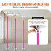 Three pink dance poles are shown in a room, with a close-up inset showing how to adjust the height. Náhled obrázku produktu