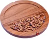 A wooden board game with many small wooden pieces scattered in a recessed area. Produktbild-Vorschau