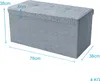 A grey storage ottoman with dimensions indicated by measurement lines and text. Produktbild-Vorschau