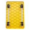 The image shows the underside of a yellow platform trolley with four black wheels and gray metal supports. Náhled obrázku produktu