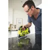 A man is using a Ryobi jigsaw to cut a countertop. Produktbild-Vorschau