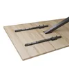 The underside of a wooden table with black metal extension rails attached. Produktbild-Vorschau