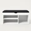 A white shoe cabinet with a black upholstered seat on top, against a plain white background. Náhľad obrázku produktu