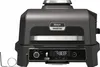 A close-up studio shot of a Ninja Woodfire Pro XL electric grill. Voir les images du produit