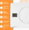 A diagram explaining the symbols on a white thermostat. Voir les images du produit