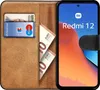 A book-style phone case for a Xiaomi Redmi 12, showing cards and banknotes inside the case. Produktbild-Vorschau