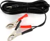 A black coiled cable with a 3.5mm jack connector and two alligator clips (one red, one black) attached to the end, laid out on a white background. Náhled obrázku produktu