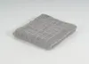 A folded gray towel is shown on a white background. Produktbild-Vorschau