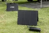 A portable solar panel and charging unit are set up on grass, likely for outdoor use. Anteprima dell’immagine prodotto