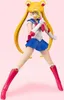 A Sailor Moon action figure posed against a pink background. Produktbild-Vorschau