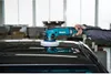 A person is using a Makita polisher on the roof of a black car. Podgląd zdjęcia produktu