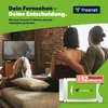 A couple is watching TV in a living room, with a freenet TV module prominently displayed. Voir les images du produit