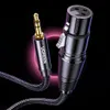 A close-up shot of a Ugreen audio cable with a 3.5mm jack on one end and an XLR connector on the other, against a dark, abstract background with a pink glow. Anteprima dell’immagine prodotto