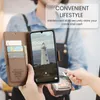 A person is making a payment with a phone case that has card slots, suggesting a convenient lifestyle. Produktbild-Vorschau